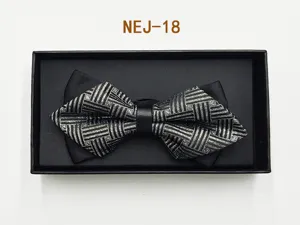 Mens black geometric bow tie in gift box, elegant wedding suit accessory detail view.