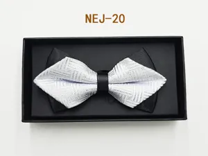 Men's black and white patterned bow tie detail view in elegant gift box, perfect for weddings.