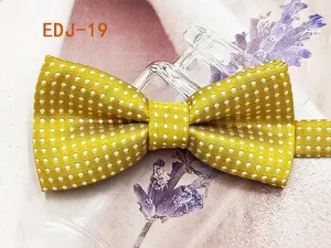Yellow polka dot bow tie detail showcasing vibrant fabric texture and double layer design.