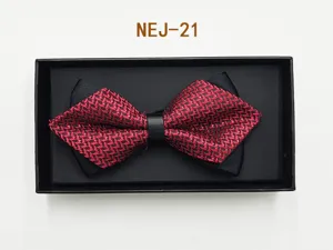 Men's elegant red and black pattern bow tie in black gift box detail shot showcase view.