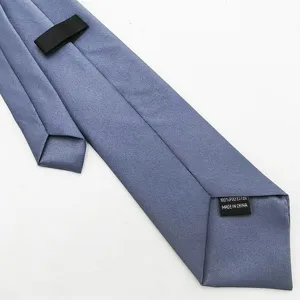Men's solid blue grey formal suit necktie with adjustable strap, classic business wear.