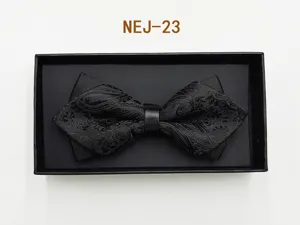 Men black bow tie with gift box, classic paisley pattern formal wedding suit accessory detail.