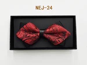 Red and black patterned bow tie detail with leather center knot in a black gift box.
