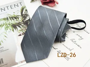 Detail shot of grey striped business necktie fabric texture and convenient pre-tied zipper structure.
