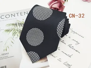 Detail shot of black business men tie with houndstooth polka dot jacquard pattern 8cm width.