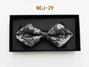 Men black silver patterned bow tie in black gift box detail close up wedding formal suit