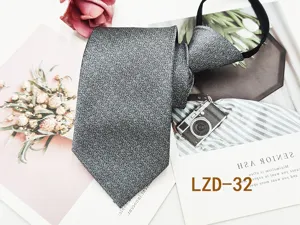 Grey glitter zipper necktie detail view, premium business formal neckwear for men daily use.