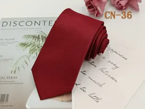 Burgundy red business necktie for men featuring elegant chevron stripe pattern fabric.