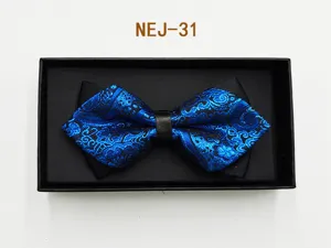Men's blue patterned bow tie in black gift box, classic wedding groom suit accessory detail.