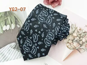 Classic black men's necktie featuring blue paisley jacquard pattern for business casual wear.