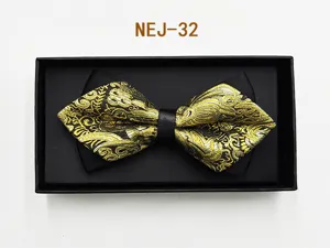 Detailed shot of a black and gold patterned bow tie in a gift box, elegant formal wear accessory.