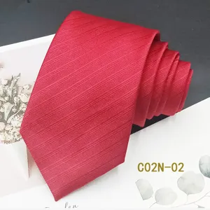 Red jacquard woven men's tie detailed view, premium formal neckwear for weddings and business.