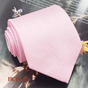 Pink ribbed men's necktie detail shot, elegant fabric texture for formal wear and business.