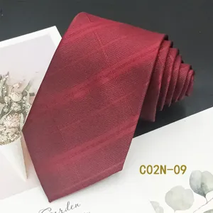 Burgundy men's formal tie with subtle jacquard pattern, perfect for weddings and business wear.