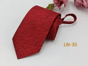 Detailed view of the red jacquard woven men's zipper tie showing fine textured pattern.