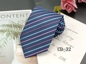 Men's business striped tie detail, dark blue with light blue and purple jacquard stripes.