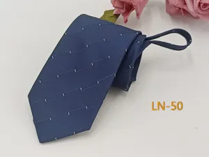 Detail view of men's blue jacquard zipper tie featuring stylish white dash patterns.