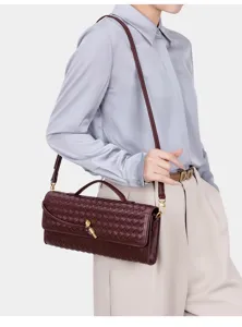 Woven leather shoulder bag for women, stylish hobo crossbody handbag with top handle and strap.