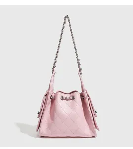 Pink quilted chain bucket shoulder bag for women, elegant commuter underarm bag detail.