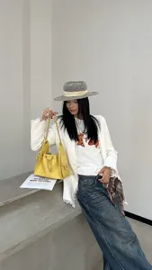Yellow quilted chain shoulder bag for women, fashion commuting bucket bag with strap.