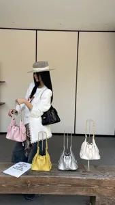 Stylish quilted chain shoulder bag, elegant commuting bucket handbag for women daily wear.