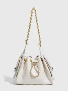 Elegant white quilted chain bucket shoulder bag for women, classic commuter handbag design.