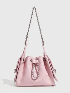 Chic pink quilted leather bucket shoulder bag with metal chain strap for women daily commute.