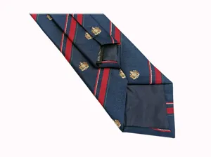 Classic striped JK tie detail showing handmade label and woven fabric texture style.
