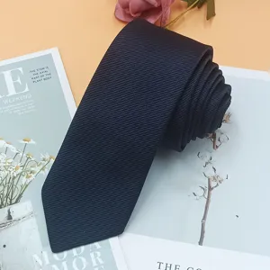 Closeup view of dark fine-stripe narrow business necktie showing fabric texture detail.