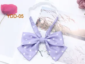Detail shot of light purple polka dot double bow tie with adjustable strap, JK style.