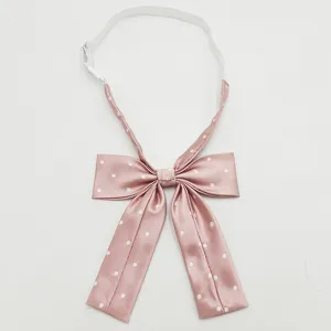 Pink polka dot JK bow tie with elastic strap, sweet Japanese style uniform collar accessory.