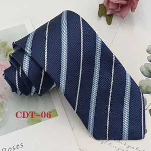 Detail shot of classic navy blue men's necktie featuring white and light blue diagonal stripes.
