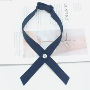 Solid color cross tie JK necktie detail view, premium fabric school uniform collar accessory.