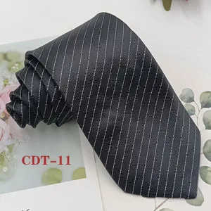 Detailed view of a classic black men's business tie featuring elegant white pinstripe patterns.