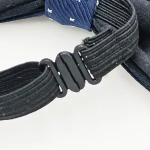 Nœud papillon pour enfants avec sangle élastique ajustable et boucle de fixation.