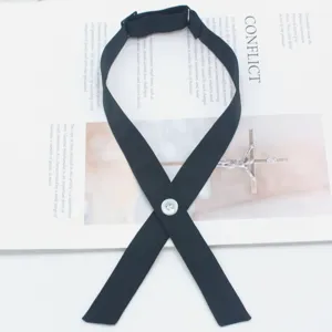 Black crossover JK uniform bow tie detail showcasing white button and adjustable strap