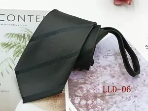 Detailed view of the black business tie, featuring neat texture and zipper design for easy wear.
