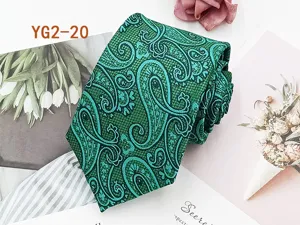Green paisley jacquard tie detail showing intricate traditional woven pattern and texture.
