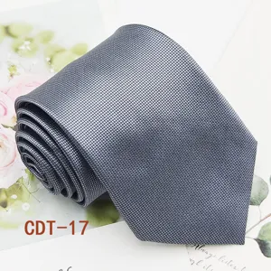 Classic grey jacquard business mens necktie detail view, premium formal wear accessory.