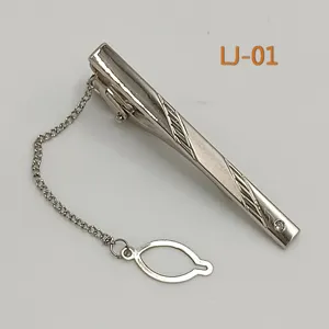 Detailed view of silver men's business tie clip featuring a delicate chain and stylish rhinestone.