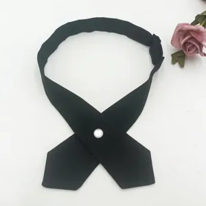 Black cross JK tie for women, featuring a white pearl button and adjustable strap detail.