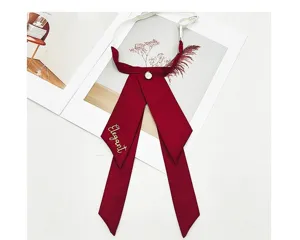 Solid color JK bow tie for women, Korean style academy ribbon with elegant embroidery detail.