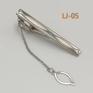 Silver metal tie clip for men business formal wear with chain design and delicate geometric patterns.