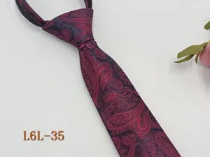 Detailed shot of a burgundy paisley zipper necktie for men, slim 6cm width ready-to-wear tie.