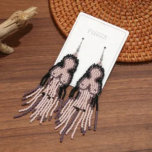 Bohemian handmade beaded fringe earrings, stylish long seed bead drop ear hooks for women.