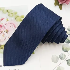Dark blue textured slim necktie for men business casual formal wear accessory detailed shot view