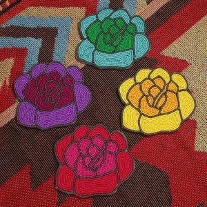 Handmade beaded rose coasters set, colorful floral cup mats for table decor and gifts.