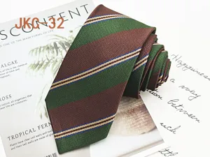 Green and brown striped necktie detail shot, casual jacquard woven fabric accessory.