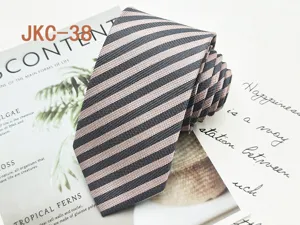 Detail view of a 7cm striped JK uniform necktie with classic diagonal pattern for daily wear.