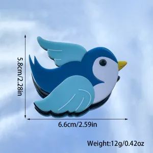 Cute blue bird acrylic brooch pin for women, charming animal lapel pin fashion accessory.